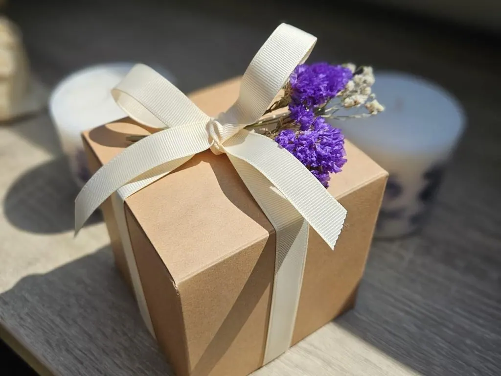 Handmade gift box tied with ivory ribbon and dried lavender